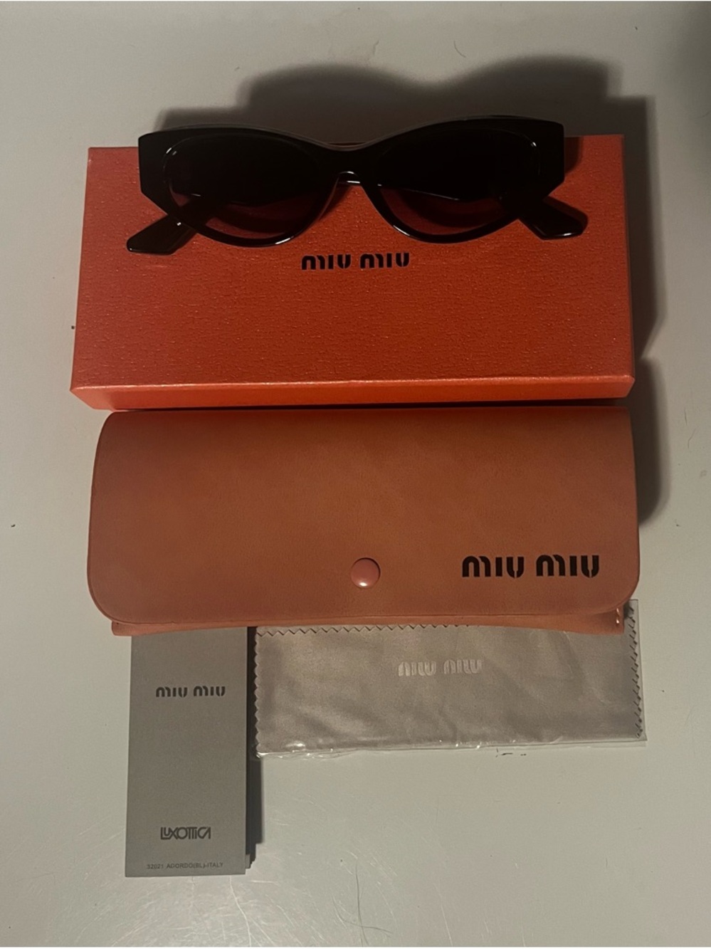 Miu Miu Gloss Black Cat Eye Sunglasses